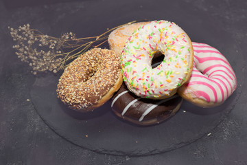 Tasty doughnuts with sprinkles