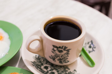 Black Coffee Traditional Singapore Breakfast called Kaya Toast,