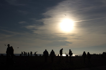 People's silhouettes at the beach