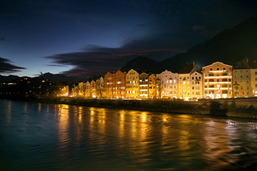 Fototapeta na wymiar Night cityscape with river in the Innsbruck city