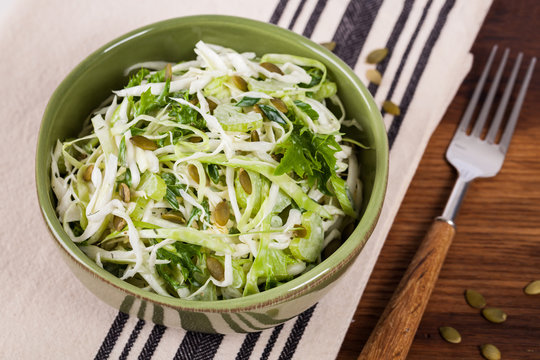 Coleslaw Cabbage Salad with Pumpkin Seeds. Selective focus.