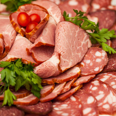 Assorted Deli Cold Meats on a plate. Selective focus. 