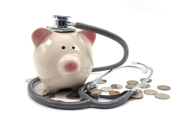 Doctor Holding Stethoscope to Piggy Bank