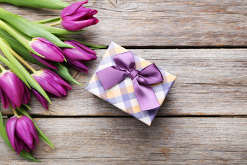Bouquet of tulips on a grey wooden table