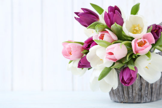 Bouquet of tulips on a wall paneling background