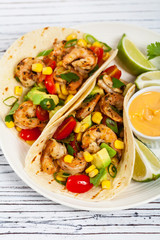 Shrimp Tacos with Corn and Avocado Salsa. Selective focus.