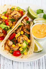 Shrimp Tacos with Corn and Avocado Salsa. Selective focus.
