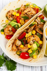 Shrimp Tacos with Corn and Avocado Salsa. Selective focus.