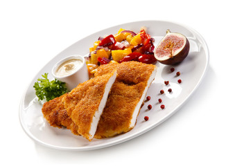 Fried pork chop coat in breadcrumbs and vegetable salad 