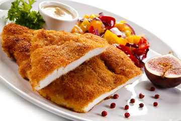 Fried pork chop coat in breadcrumbs and vegetable salad 