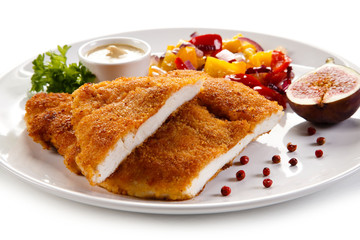 Fried pork chop coat in breadcrumbs and vegetable salad 