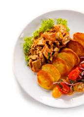 Goulash with baked potatoes and vegetables 