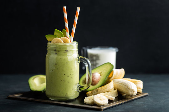 Fresh blended Banana and avocado smoothie with yogurt or milk in mason jar, healthy eating, superfood
