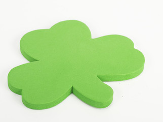 Bright green shamrock on white background