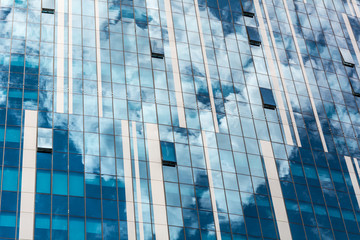 reflection of the sky and clouds in building windows