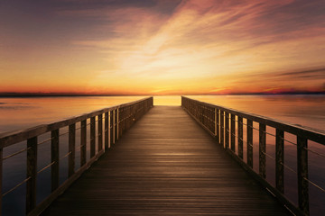 Fototapeta na wymiar Bridge on calm sea at twilight time