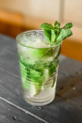 Cold tasty mojito cocktail drink with mint, ice and lime