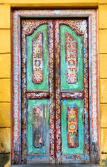 Fototapeta na wymiar The old wood door with painting