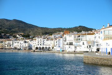 Fototapeta na wymiar cityscape of Dali famous landmark spanish village Cadaques port on blue mediterranean sea sunny day