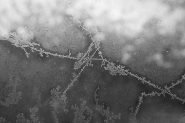 Belarus-October 13, 2016 Frosty drawing on window glass, drawing with frost on the window, black and white image, ottaevshee glass windows, beautiful pictures, the artist frost,yin and yang