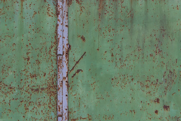 green metal erased rusty scratched old fence