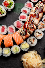 Japanese cuisine. Sushi on a stone plate.