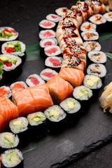 Japanese cuisine. Sushi on a stone plate.