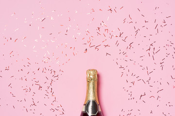 Flat lay of Celebration. Champagne bottle with colorful party st - obrazy, fototapety, plakaty