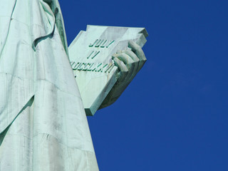 A detail of the Statue of Liberty in the harbor of New York City.