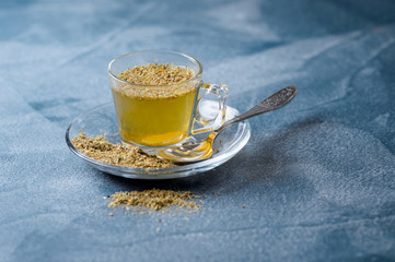 Herbal linden tea helps to fight flue. Selective focus.