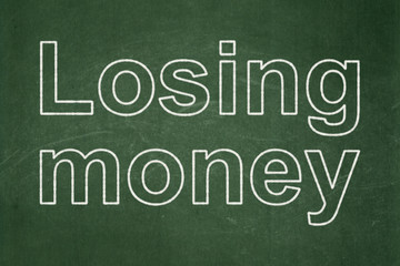 Obraz premium Money concept: Losing Money on chalkboard background