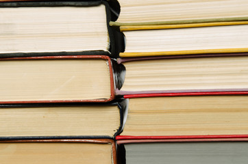 a stack of colorful books in a library