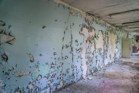 peeled paint on the wall of a desolate building in abandoned Pripyat. Chernobyl zone