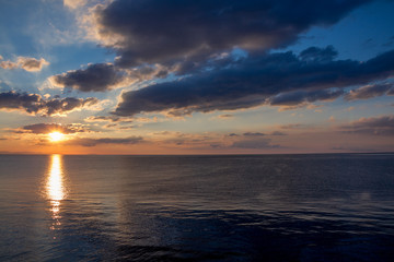  SCENIC VIEW OF BEAUTIFUL SUNRISE ABOVE THE SEA GREEN AND CLEAN WATERFALL