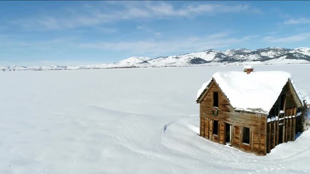 Cold winter on the prairie sits an abandon homestead in Idaho