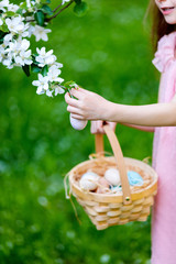 Fototapeta na wymiar Little girl playing with Easter eggs