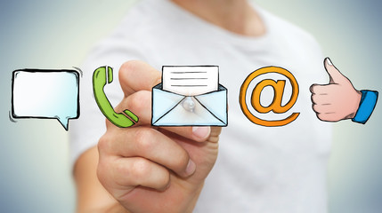 Businessman drawing manuscript contact icon with a pen