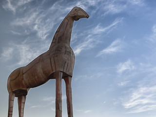 Big horse statue stands in the sky, this figure reminds horse of troy
