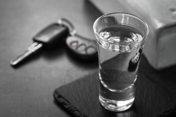 Vodka shot drink and car key.