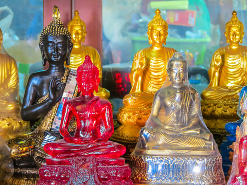 Figures of the sitting Buddha in the Wat Saket Temple or Golden mount, Bangkok, Thailand