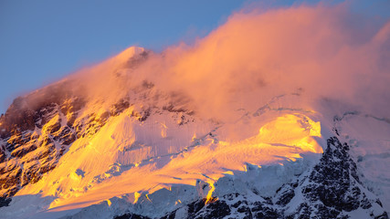 Landscape detail of glacier in colorful golden sunset, NZ
