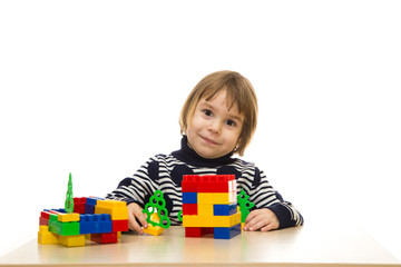 Girl or boy 3-4 years old on a white background is happy and lau