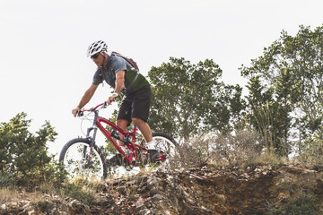 Adult man on mountain bike. Active person