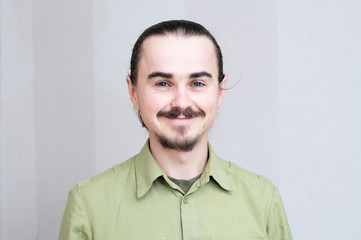 Happy smiling mustache man portrait looking  at camera,bearded handsome young men full face expressing positive emotion