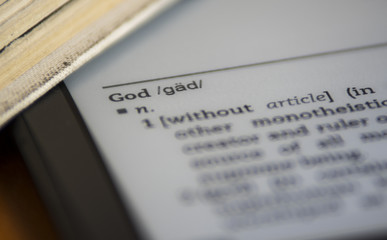 Word God in electronic dictionary close up