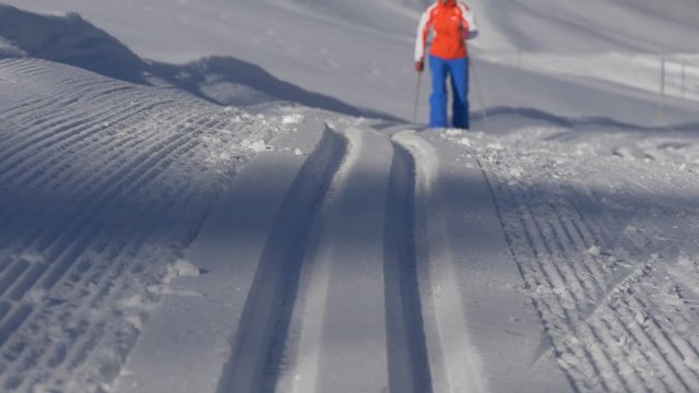 Track from the cross-country ski and the skier riding on this track