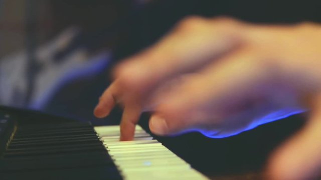 Playing piano. Close Up view. Two hands playing the pianoin in studio