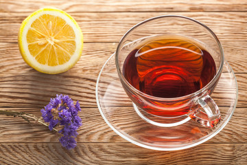 tea in cup of glass on a wooden background