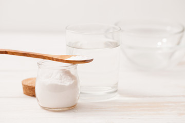 sea salt, starch in the jar and wooden spoon for recipes of cosm
