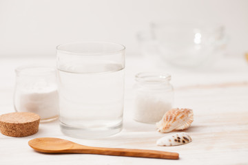 sea salt, starch in the jar and wooden spoon for recipes of cosm